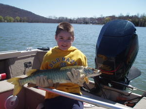 Ryan Young with his first musky a 33 incher with beautiful markings