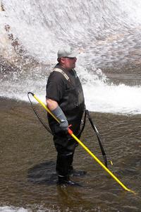 Craig electro-shocking the water below GWL dam during a fish rescue